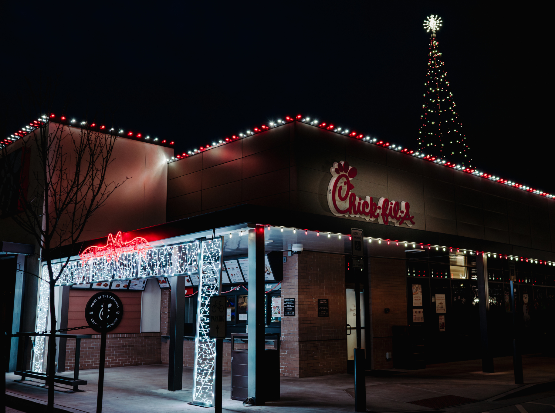 Professional commercial holiday lighting installation at Chick-fil-A Oregon