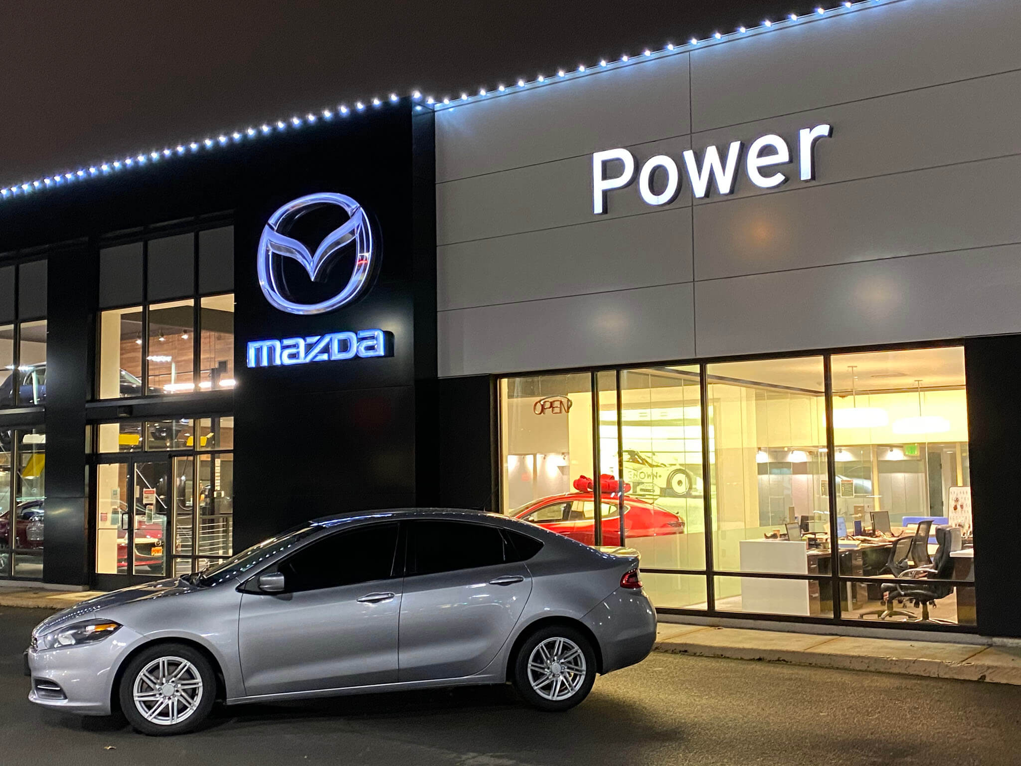 Commercial holiday lighting installation at Power Mazda dealership Oregon