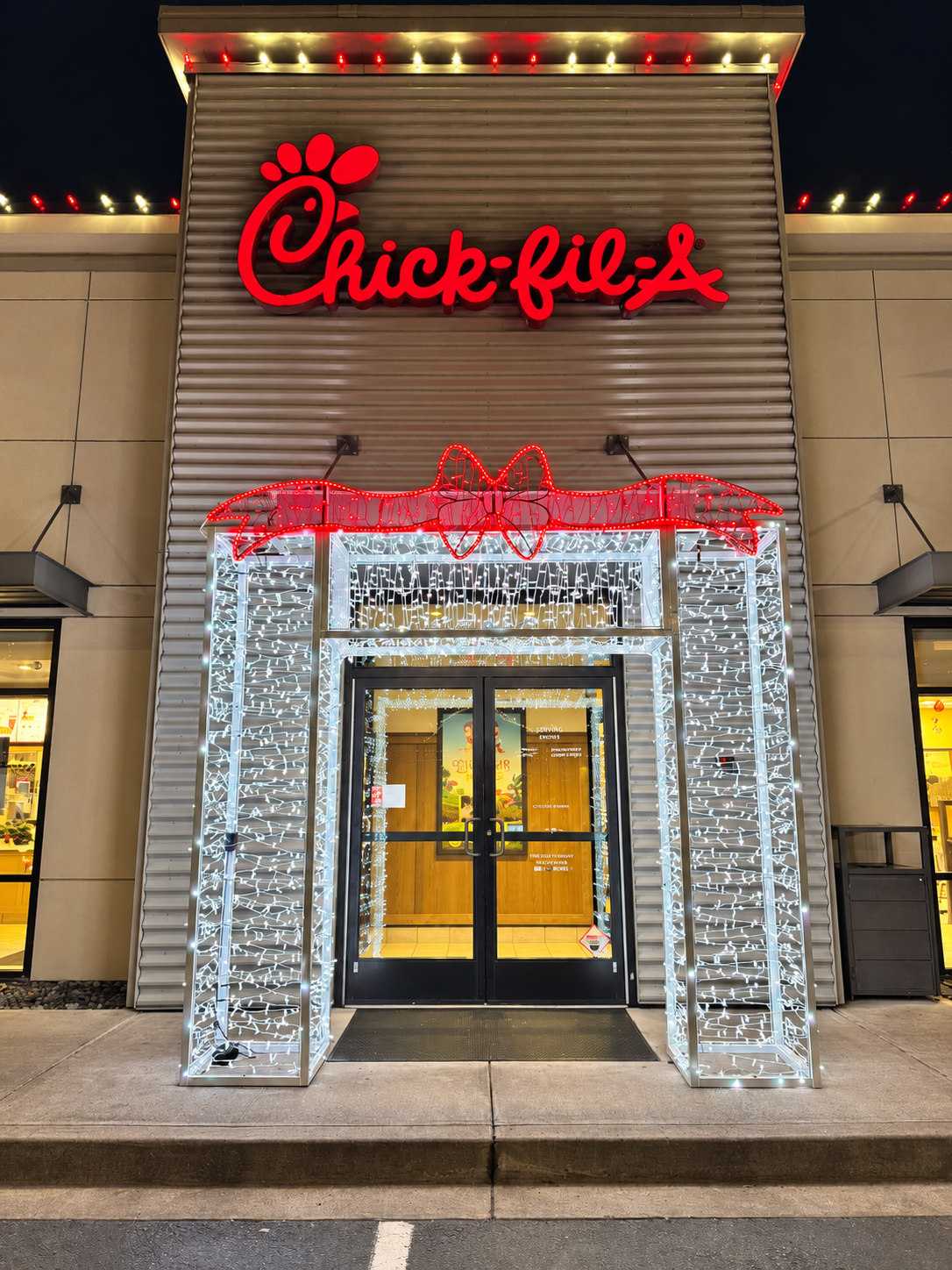 A festive commercial entrance by CLG Outdoor Lighting